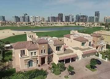 Villas at Victory Heights with golf course and Dubai skyline in the background