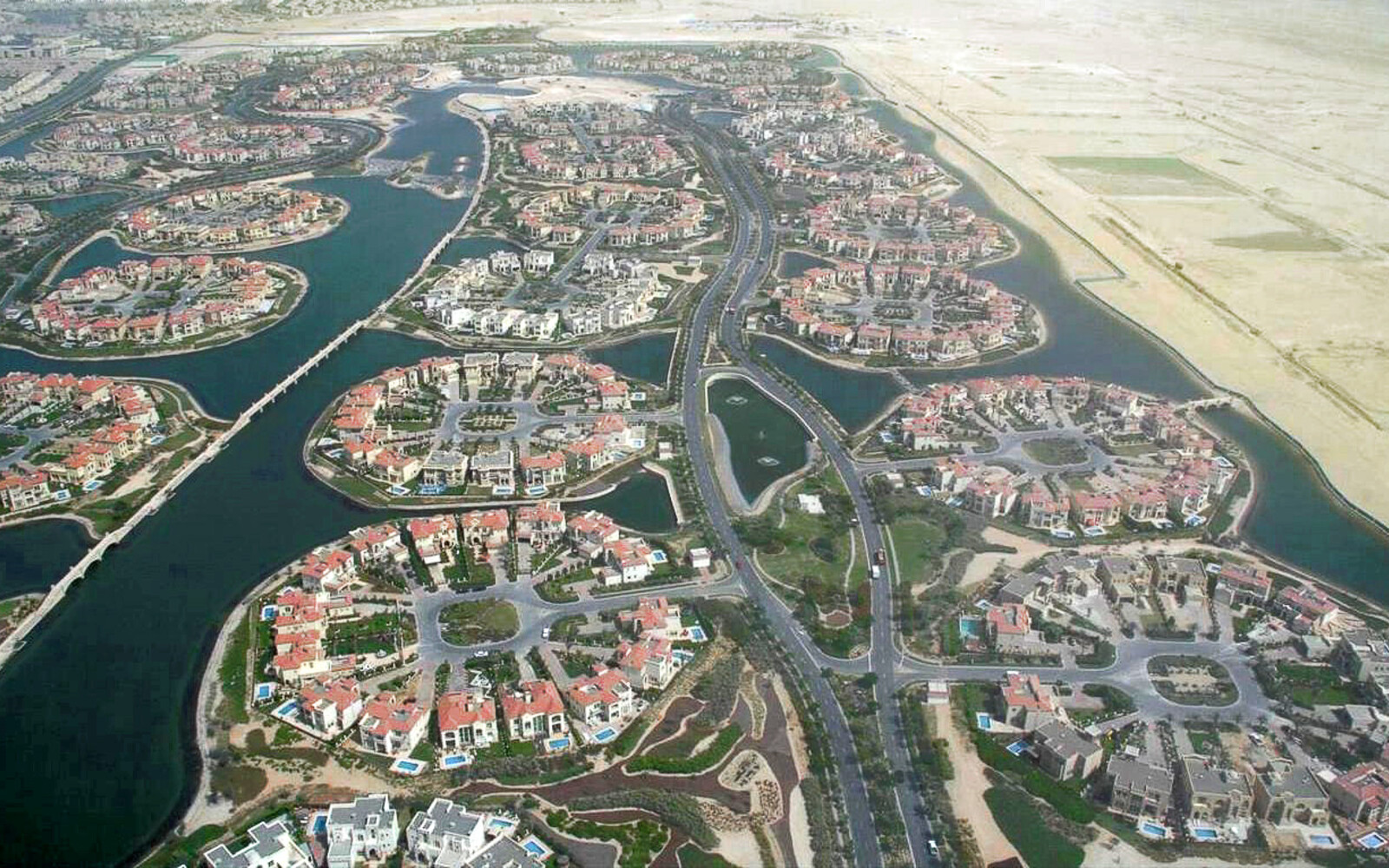 Aerial view of Jumeirah Islands villa clusters and lakes in Dubai
